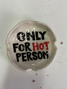 a button with the words only for hot person written in red and black on it