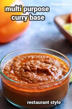 a small glass bowl filled with sauce on top of a table