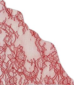 a piece of red lace with flowers on it