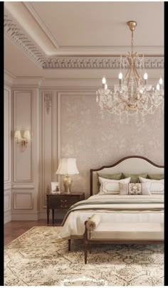 a bedroom with a bed, chandelier and two lamps on either side of the bed