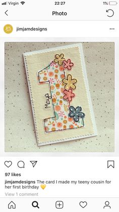 the first birthday card has flowers on it and is made from paper with an image of a