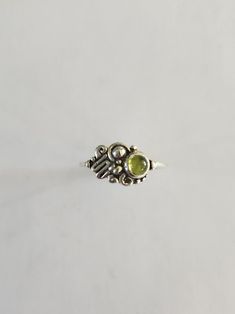 Sterling silver asymmetric abstract spiral squiggle solitaire ring bezel set with a 5mm peridot cabochon.  Size 7 1/2. Designed and handcrafted by Richelle Leigh using the lost wax casting process. Free shipping US. https://www.etsy.com/shop/RichelleJewelry Wax Casting Rings, Lost Wax Casting Rings, Wax Casting Jewelry, Lost Wax Casting Jewelry, Cast Rings, Nails Rings, Business Vision Board, Business Vision, Spiral Ring