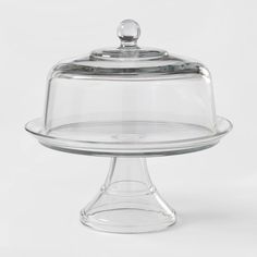 a clear glass cake dish with a domed lid