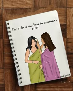 a notebook with an image of two women talking to each other on the cover, which reads try to be a rainbow in someone's cloud