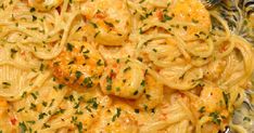 pasta with shrimp and parmesan cheese in a skillet, ready to be eaten