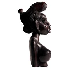 a statue of a woman with a hat on it's head and one eye closed