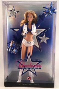 a barbie doll in a cheerleaders uniform is posed for a photo on display