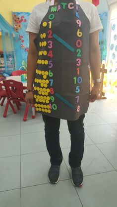 a man wearing an apron made to look like he has numbers on the front and sides