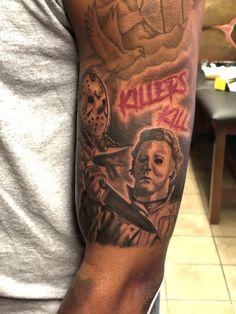 a man with a tattoo on his arm holding a knife and wearing a mask that says killer bill