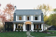 Exterior House Shutters: Ideas and Inspiration | Hunker Dutch Colonial Exterior, Jean Stoffer, Dutch Colonial Homes, White Exterior Houses, Colonial Farmhouse, House Shutters, Gambrel Roof, Colonial Exterior, Black Barn