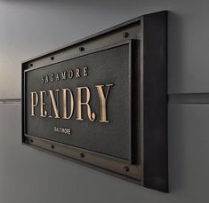 there is a sign on the wall that says pendry and it reads sagmmore