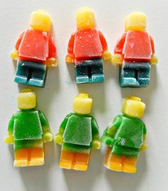 four lego figures made out of gummy bears