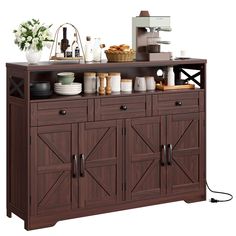 a kitchen island with lots of food on top of it and an electric outlet plugged into the sideboard