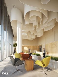 an office lobby with modern chairs and plants