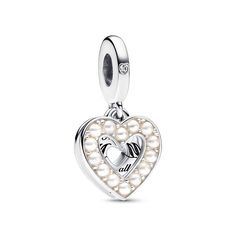 An elegant gift for a mum who loves pearly tones. The Pearlescent White Heart Double Dangle Charm is crafted from sterling Silver and features a cut-out heart shape adorned with a row of bioresin man-made mother of pearl stones. Behind this is another heart-shaped disc with the engraving "Thanks M❤M for all that you do", with a cut-out heart at the centre forming the central letter in the word "M❤M". Celebrate the mother figure in your life with a jewellery gift that speaks to your gratitude... Cute Pandora Charms, Pandora Bracelet Charms Ideas, Pandora Jewelry Charms, Charms Pandora, Bracelets Design, Bracelet Pandora, Bracelet Charms, Pandora Bracelet Charms, Mors Dag