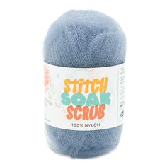 a blue ball of yarn with the words stitch soak scrub on it's side