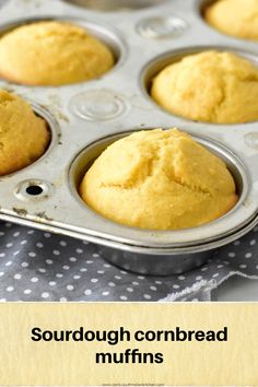 a muffin tin filled with yellow cornbread muffins