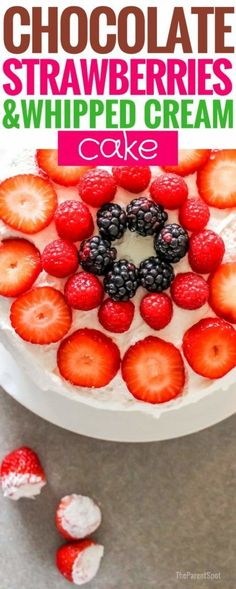 chocolate strawberries and whipped cream cake on a white plate with fresh berries around it