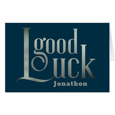 a card with the words good luck and jonathan written on it in silver foil, against a dark blue background