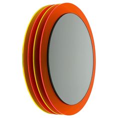 four round mirrors stacked on top of each other in an orange and yellow frame, against a white background