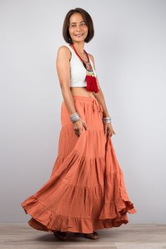 "Orange skirt, Women's Tiered peasant maxi skirt,  Long orange boho skirt, Mamma mia skirt, double cotton gauze skirt, flare skirt, skirt with pocket, skirt for women, sleeveless dress, donna sheridan skirt, terracotta skirt Elastic waistband and a drawstring for a perfect fit. PRODUCT SIZE : One Size Fits Most * Waist : max up to 44\" * Hips : up to 54\"  * Length : 38\" from waist to hem NOTE :  * Model chest : 32\", waist : 24\" hips : 35\"  * Combined Height is 5\"6 > I'm 5\"2 (158cm) and I' Bohemian Flowy Maxi Dress With Gathered Skirt, Festival Tiered Ruffled Maxi Skirt, Bohemian Maxi Dress With Gathered Skirt, Bohemian Ruffled Maxi Skirt For Spring, Spring Bohemian Ruffled Maxi Skirt, Gathered Maxi Skirt For Beach, Spring Bohemian Maxi Skirt With Ruffles, Maxi Length Gathered Skirt For Beach, Beach-style Gathered Maxi Skirt