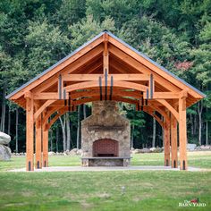 an outdoor fireplace in the middle of a park