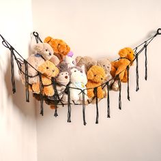 a bunch of stuffed animals that are on a string