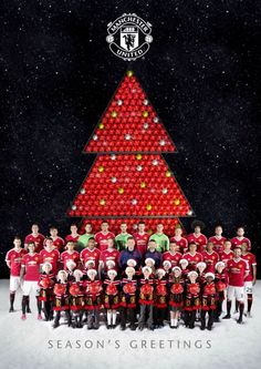 the manchester united team is posed in front of a christmas tree made out of beer cans