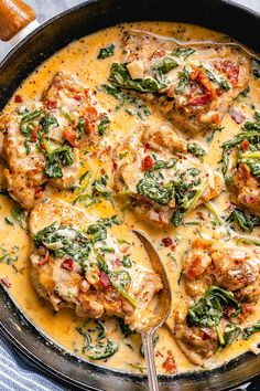 chicken with spinach and cheese in a skillet