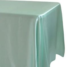 a light green table cloth on a white background