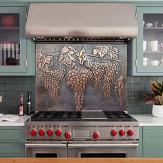 a stove top oven sitting inside of a kitchen next to a wall covered in wine bottles