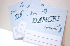 three blue and white cards with musical notes on them, one has the word dance written in black