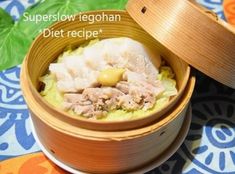 a wooden bowl filled with meat and vegetables