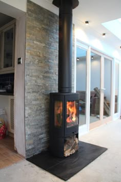 a wood burning stove sitting inside of a living room