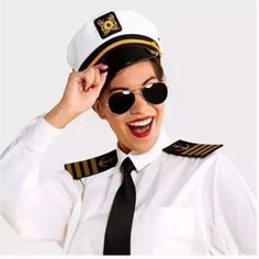 a woman wearing sunglasses and a pilot's hat