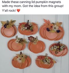 pumpkins with flowers and leaves on them are arranged in the shape of small plates