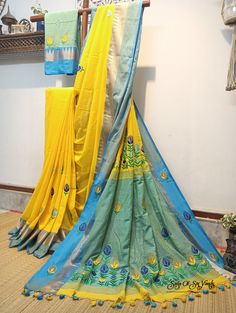 Elevate your ethnic wardrobe with our stunning handloom pure cotton saree in vibrant yellow, adorned with a magnificent firoza-colored temple woven border. This saree is a masterpiece of craftsmanship, featuring intricately embroidered multicolor floral design, neatly and artistically crafted onto the fabric. In addition to its exquisite design, this saree is designed for comfort and style. Crafted from pure, soft cotton, it offers a luxurious and comfortable drape, making it a joy to wear on any occasion. To complete the ensemble, a matching blouse piece with delicate embroidery work is included. Discover the perfect blend of tradition, artistry, and comfort with this exceptional pure cotton saree. Elevate your fashion quotient while celebrating the rich heritage of Indian textiles. Shop Yellow Cotton Traditional Wear With Resham Embroidery, Yellow Traditional Wear With Resham Embroidery In Mulmul, Yellow Mulmul Traditional Wear With Resham Embroidery, Yellow Traditional Wear With Pallu In Mulmul, Yellow Traditional Wear With Embroidered Border For Navratri, Yellow Semi-stitched Cotton Traditional Wear, Yellow Cotton Dupatta With Zari Work, Yellow Mulmul Traditional Wear With Pallu, Yellow Mulmul Traditional Wear With Cutdana