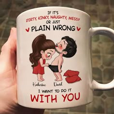 a person holding a coffee mug with an image of two women kissing and the words dirty, kink'n naught messy or just plain wrong