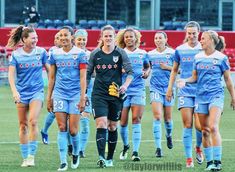 women's soccer team walking onto the field