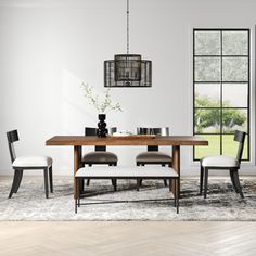 a dining room table with four chairs around it