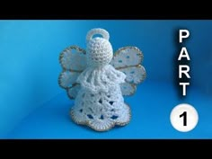 a crocheted angel sitting on top of a blue background with the words part 1 written below it