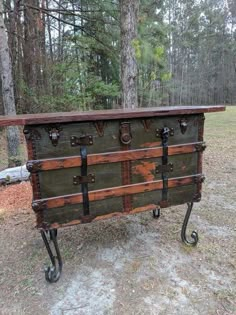 an old trunk is sitting in the woods