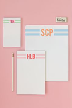 two notepads with the word scp on them next to a pencil and eraser