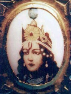 an old photo of a woman with a crown on her head in a gold frame