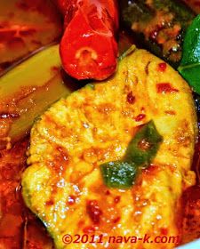 a close up of food in a bowl with peppers and broccoli on the side