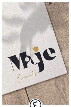 the logo for an event is shown on a piece of white paper with black and gold lettering