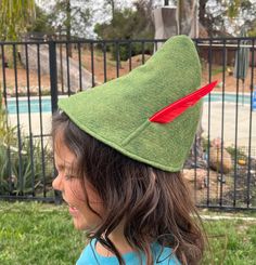 Peter Pan Hat or Zelda Elf Hat October Fest Tyrolean Alpine Hat with Feather Costume Hat This is a reproduction of the Hat that Peter Pan wears in the Animated Cartoon Peter Pan. It can also be worn with a Zelda Costume or Elf Costume. The hat is made of an Olive Green Wool Felt fabric, lined in fleece fabric. Other colors are available in my other listing.  This item is custom made. Please allow between 4-5 days for completion and an additional 4-5 days for shipping within the United States. If Peter Pan Hat, Feather Costume, Zelda Costume, Peter Pan Costume, October Fest, Hat With Feather, Wool Felt Fabric, Elf Costume, Elf Hat