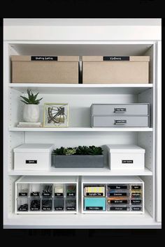 the shelves are organized with boxes, file folders and other office supplies on them