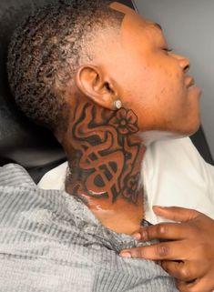 When it comes to chest and neck tattoo ideas for men, the options are virtually limitless. Many men opt for larger designs that cover the entire chest, often extending to the neck. For example, fierce animals, such as lions or eagles, can symbolize strength and courage.  Moreover, geometric patterns are becoming increasingly popular. They can be combined with other elements, like flowers or celestial designs, creating a visually appealing effect. Ultimately, the goal is to find a design that res Name Tattoos Behind Ear Men, Biblical Neck Tattoos, Neck Tattoo Hood, Gangsta Neck Tattoo, Half Neck Tattoo Men, Black Hood Tattoos For Men, Neck Tattoo Men Black, Money Bag Neck Tattoo, Neck Tattoo Stencil For Men