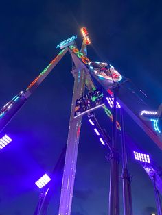 an amusement park ride lit up at night